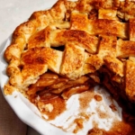 The inside of a apple pie with a cheddar crust.