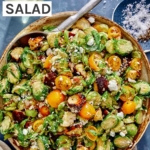 Shaved brussel sprout salad recipe in a bowl.