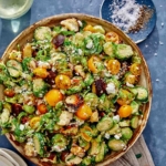 Shaved brussel sprout salad recipe in a bowl.