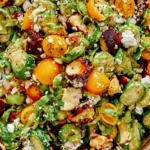 Shaved brussel sprout salad recipe in a bowl.