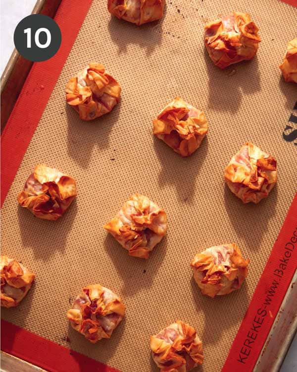 Brie bites being brushed with butter.