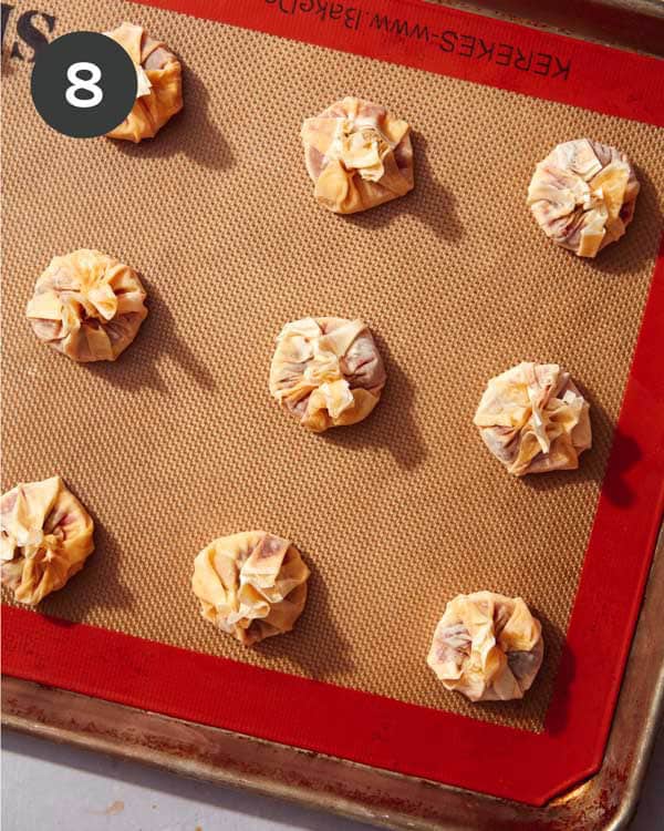 Brie bites on a baking sheet ready to be baked.