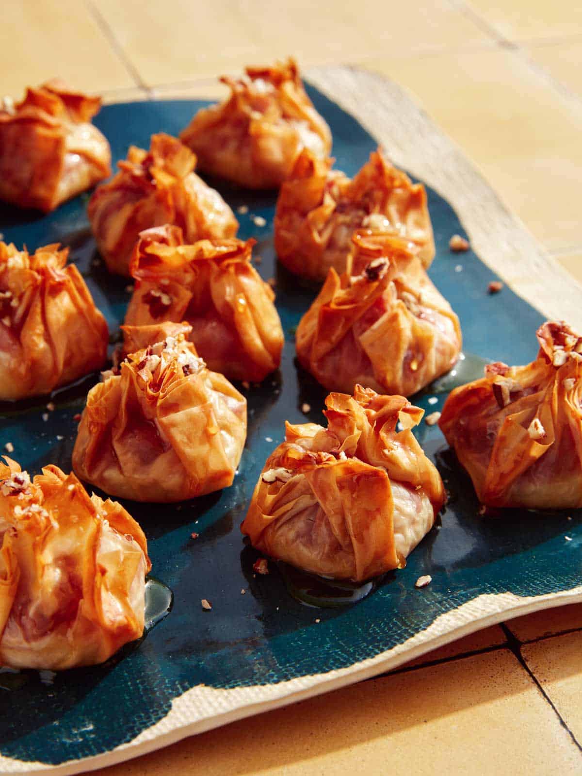 Crispy brie bites on a platter.