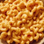 Super close of cheesy crock pot mac and cheese.