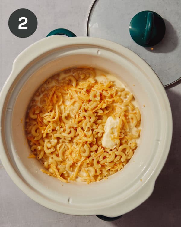 Crock pot mac and cheese ingredients in a crock pot ready to be mixed up!