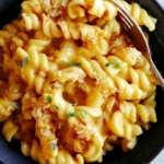 Up close on a bowl of pumpkin mac and cheese.