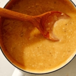 Roasted garlic gravy in a pot simmering.