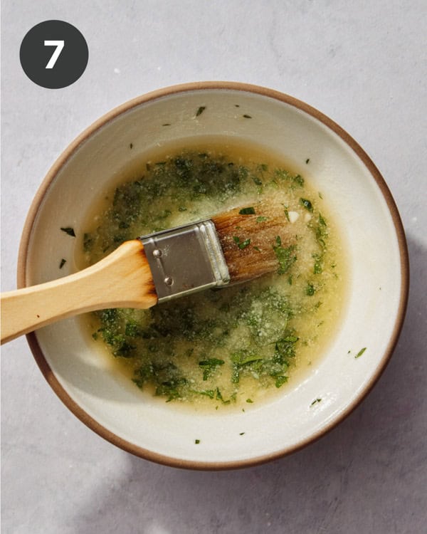 Butter topping mixture for cheddar bay biscuits in a bowl.