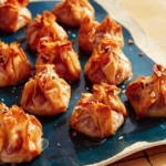 Crispy brie bites on a platter.