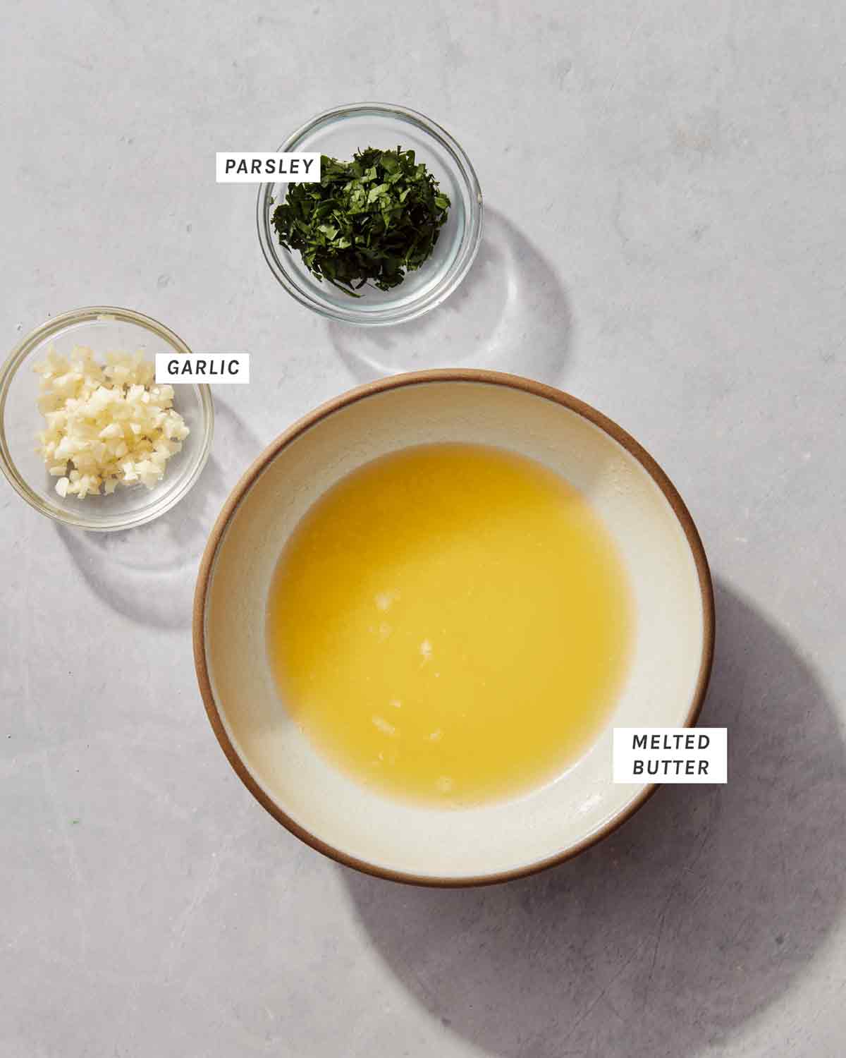 Ingredients for cheddar bay biscuit topping in bowls.