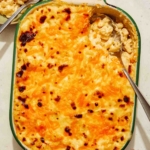 Easy baked mac and cheese in a dish with a spoon in it.