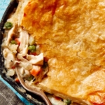 Close up on a chicken pot pie in a skillet.