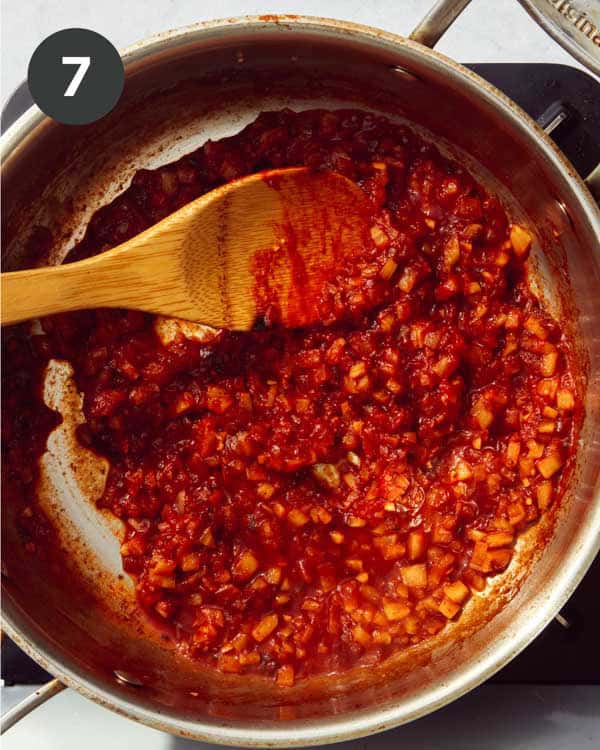The base of a red sauce pasta cooking in a skillet.