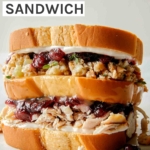 A huge leftover Thanksgiving Sandwich built and ready to be eaten.