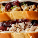 Up close on the layers of a Thanksgiving leftover Sandwich.