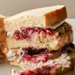A thanksgiving leftover sandwich cut in half.