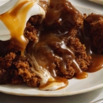 Sticky Toffee pudding recipe in two plates with a fork.
