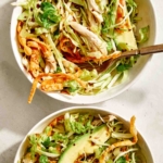 Sesame ginger chicken salad in two bowls.
