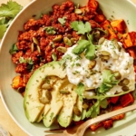 Beef protein bowl up close with a fork in the bowl.
