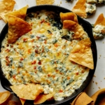 Spinach and artichoke dip in a skillet.
