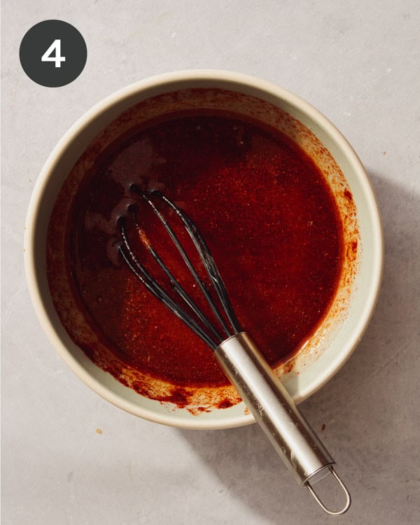 Honey butter in a bowl that was just mixed together with a whisk.