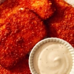 Mozzarella sticks in a basket with ranch on the side.