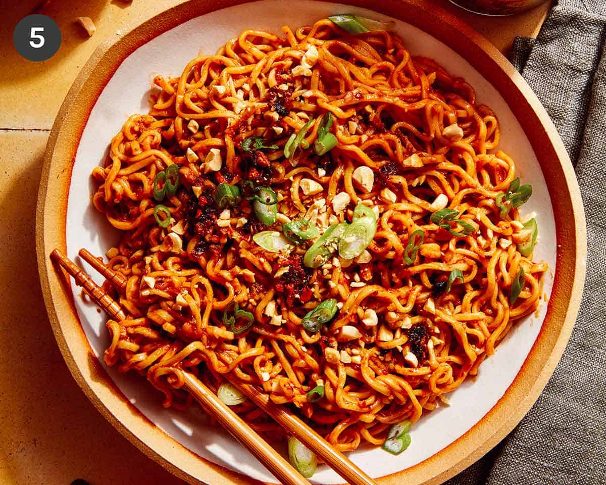 Spicy Ramen Noodles in a bowl with green onions on top.