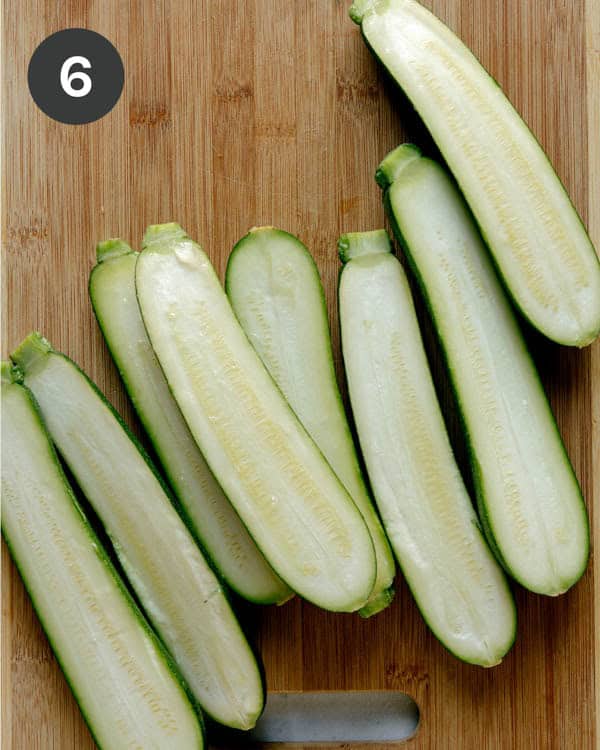 Zucchini sliced in half for zucchini boats. 