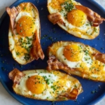 Twice baked breakfast potatoes on a blue plate.