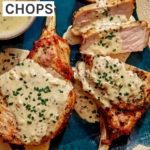 Air fryer pork chops on a platter up close with a sauce over top.