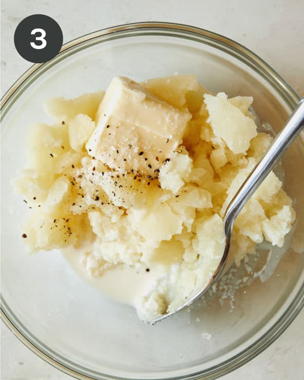 Mashed potatoes with butter and cream and salt and pepper on a bowl.