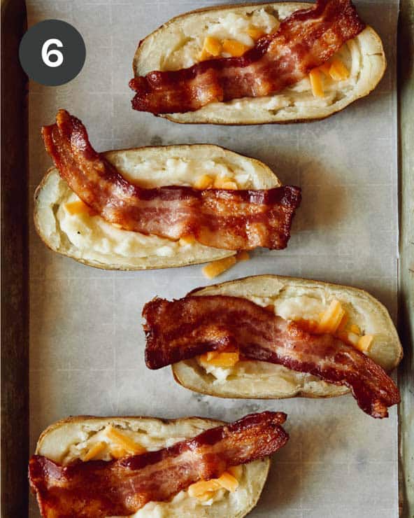 Bacon and cheese in potato halves.