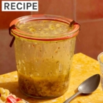 Italian vinaigrette recipe on a table in a jar.
