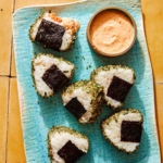 Spicy Tuna Onigiri recipe on a plate with masago sauce.