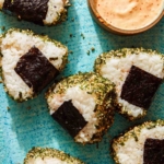Spicy Tuna Onigiri recipe on a plate with masago sauce.