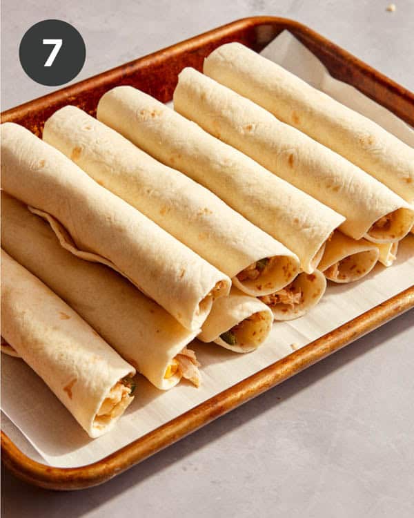Rolled flautas on a sheetpan.