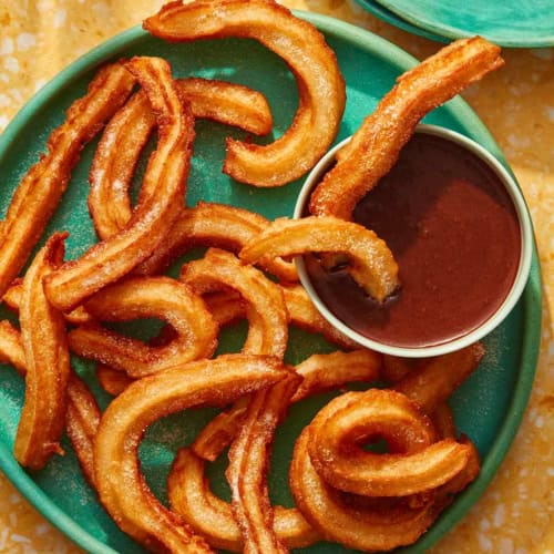 Spanish Churros with chocolate sauce on the side.