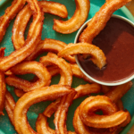 Spanish Churros with chocolate sauce on the side.