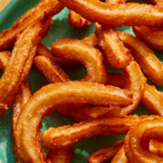 Close up on a plate of Spanish Churros.