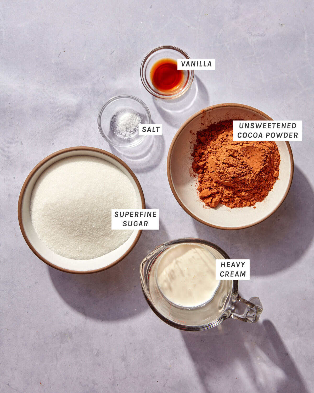 Ingredients to make a homemade chocolate sauce all laid out.