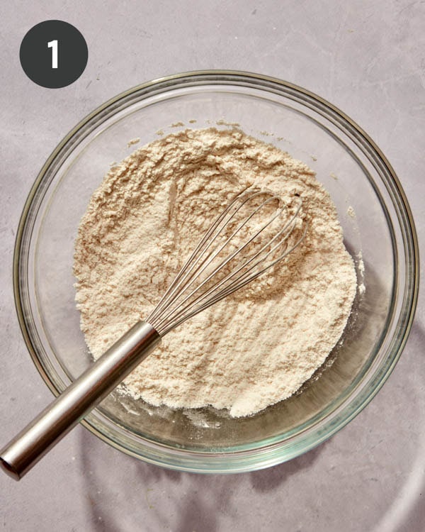 Dry ingredients in a bowl being whisked together to make Spanish Churros.