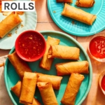 Vietnamese spring rolls on a platter with a bowl on sweet chili sauce.