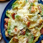 Close up on a platter full of caesar salad.