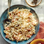 Hawaiian style macaroni salad in a bowl with some served.