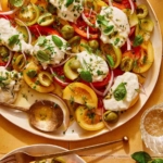 Tomato salad on a plate with some served.