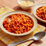 Spaghetti Os in two bowls ready to be eaten.