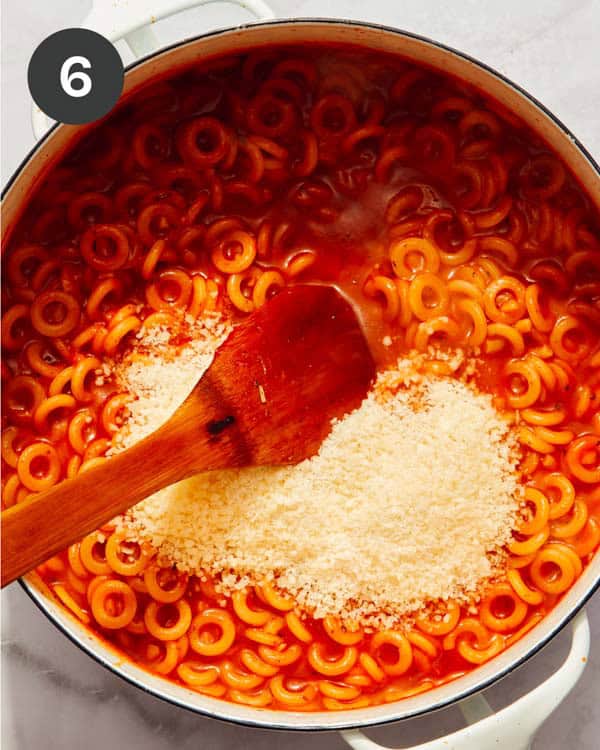 Spaghetti Os pasta cooked with parmesan in a pot.