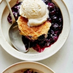 Blueberry cobbler recipe served into two bowls.