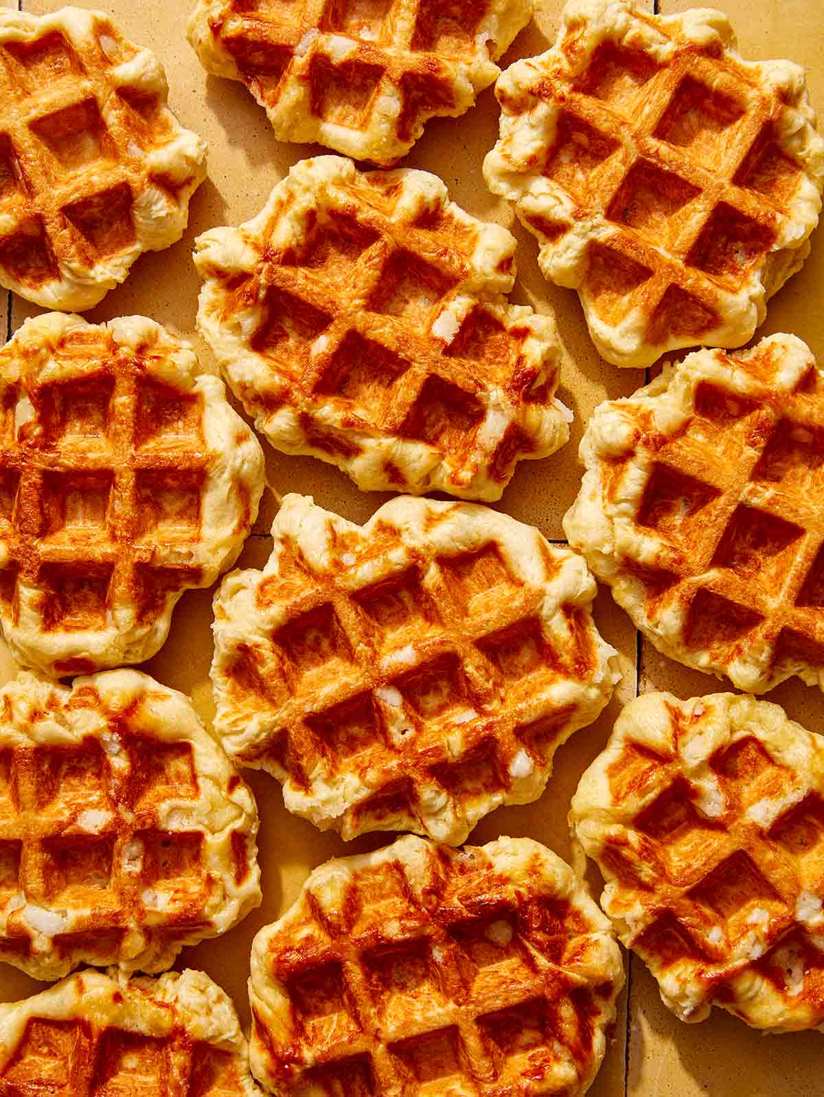 Liege waffles freshly made on a kitchen counter.