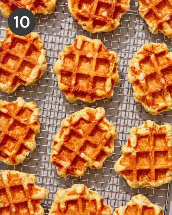 Liege waffles resting on a cooling rack.